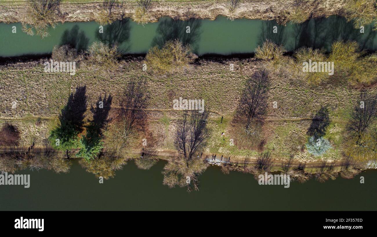 An aerial view of a river with trees alongside Stock Photo - Alamy