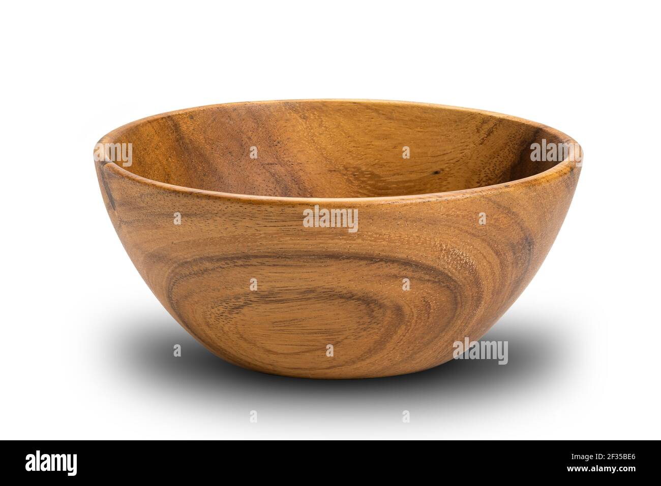 Closeup view of wooden bowl on white background with clipping path. Side view of empty wooden bowl isolated. Stock Photo