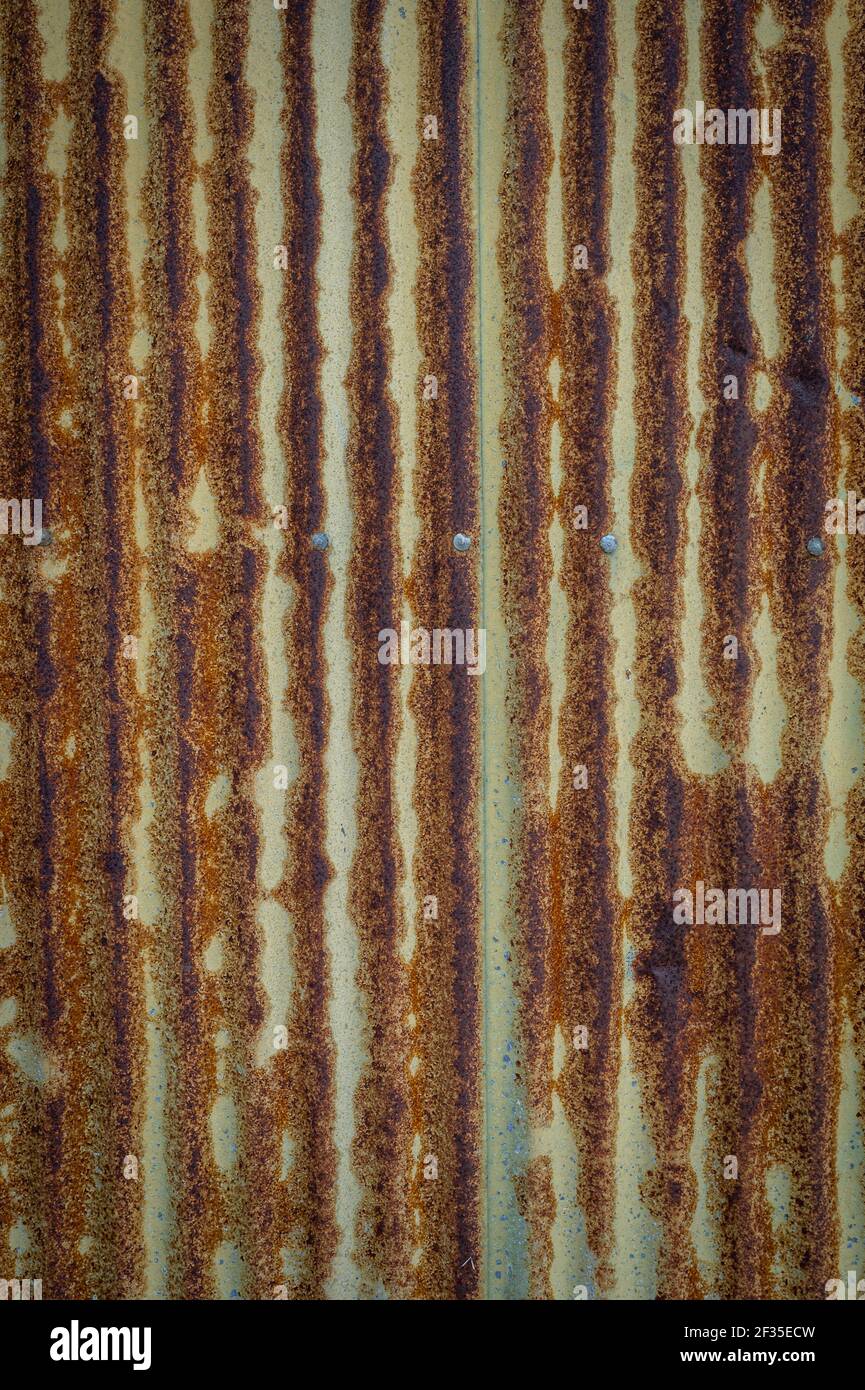 Rusty galvanized, corrugated iron siding, texture background Stock Photo