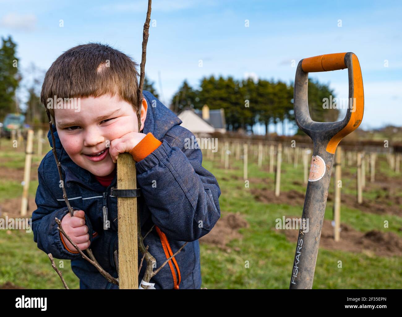 British child planting tree hi-res stock photography and images - Alamy