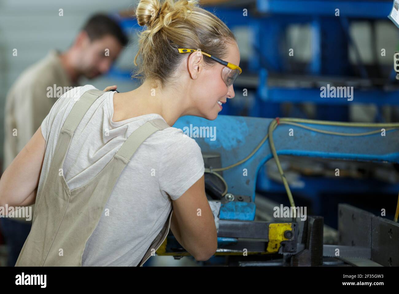 A Happy Female Factory Worker Stock Photo Alamy