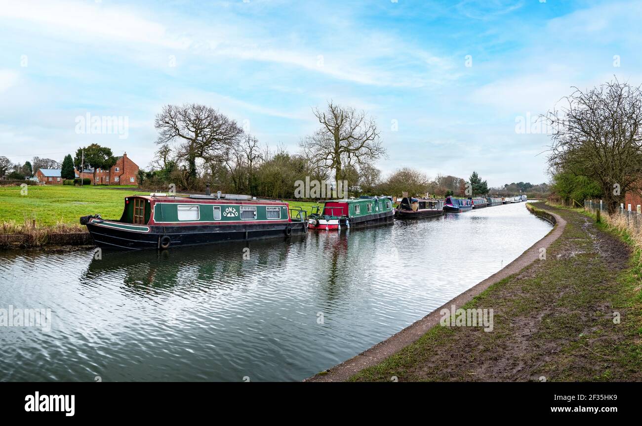 Panoramic image of narrow boats on the Trent and Mersey canal  near Sandbach Cheshire UK Stock Photo