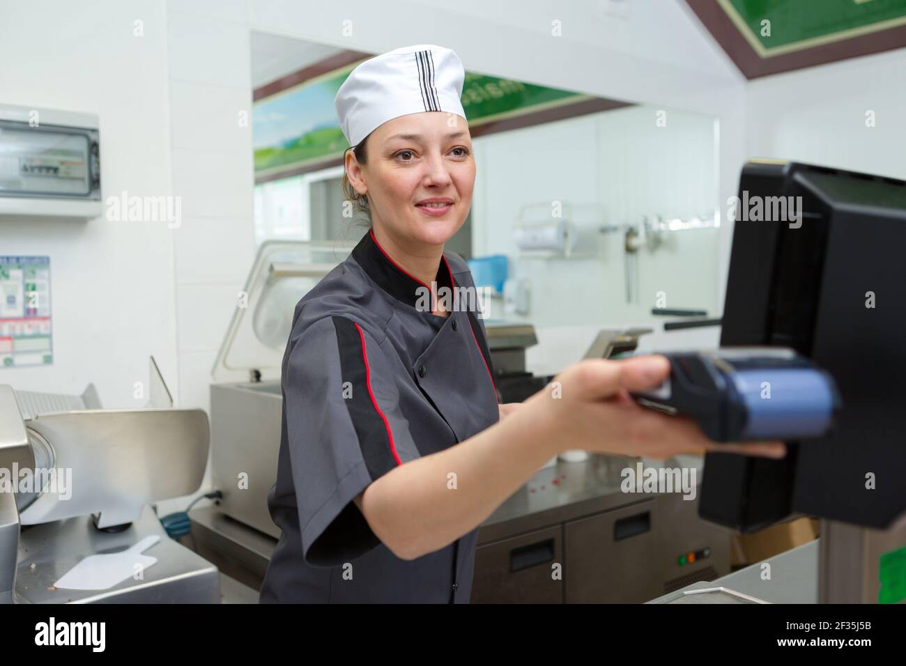 customer paying at butchers shop Stock Photo Alamy