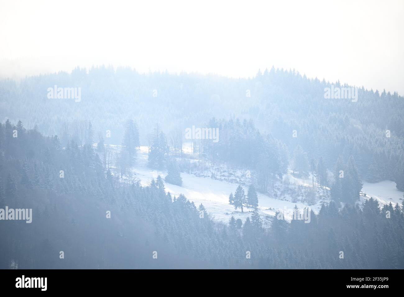 Foggy, snowy landscapes of mountains Stock Photo