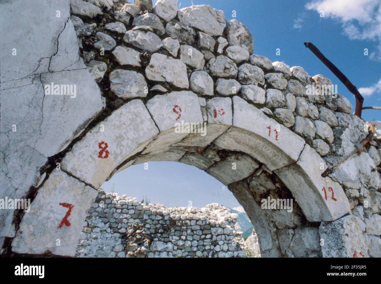 Reconstruction in Friuli (Northern Italy) after the earthquake of May 1976, remaking of the ancient medieval walls of Venzone village  with the original stones (February 1980) Stock Photo