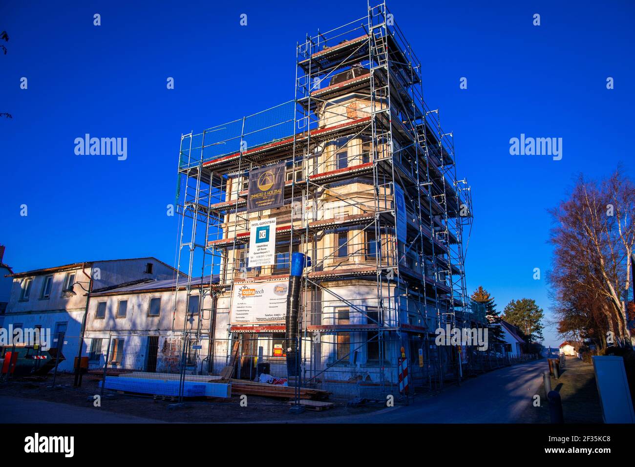 Vitte, Germany. 10th Mar, 2021. The residential building at Süderende in Vitte on the island of Hiddensee, which has been empty for decades, is being renovated. Vitte, the largest village on the island with 650 inhabitants, is also its administrative centre. The small island of Hiddensee has many thousands of tourists. Credit: Jens Büttner/dpa-Zentralbild/ZB/dpa/Alamy Live News Stock Photo