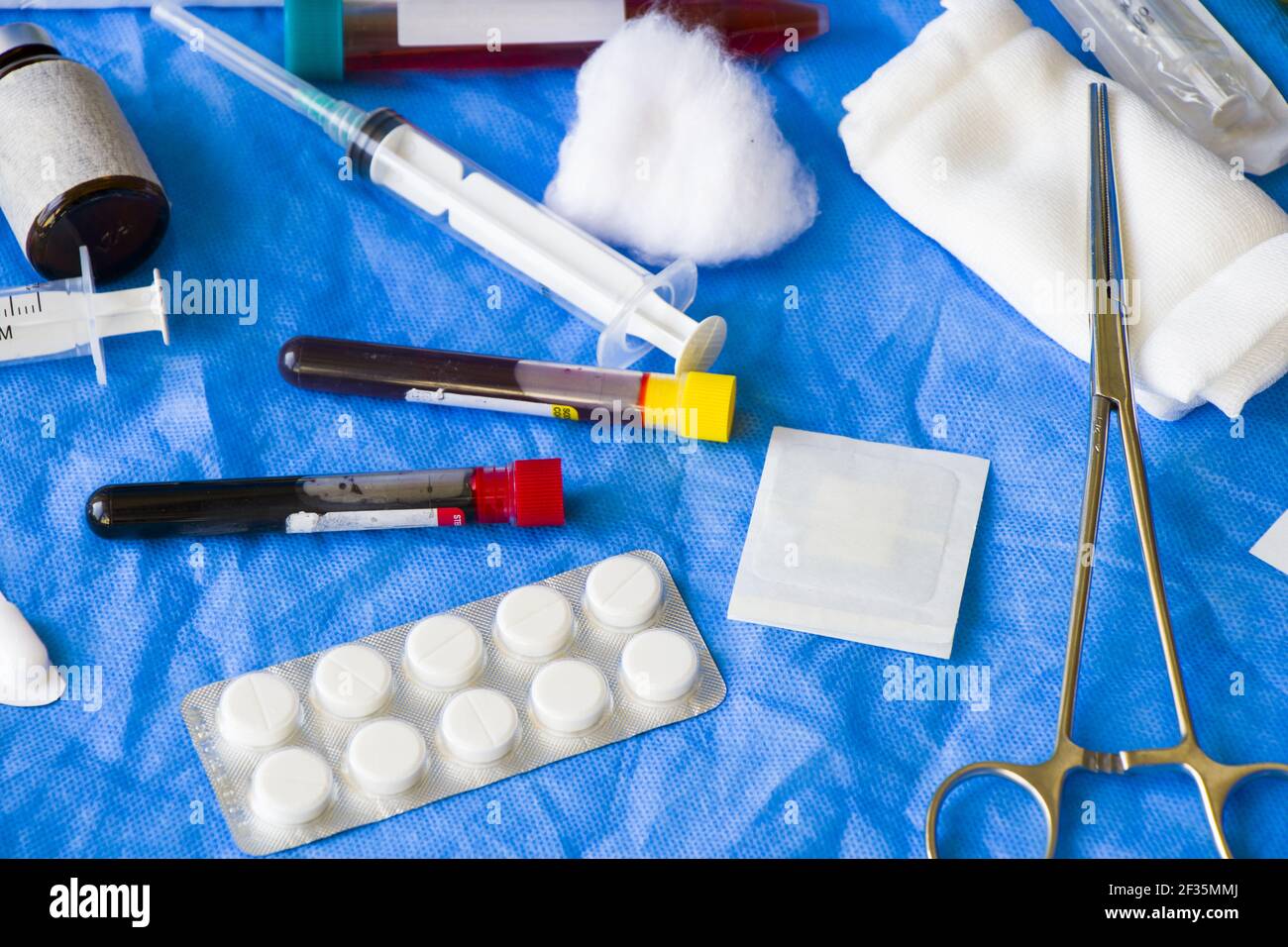 A high angle shot of blood test tube sample, vaccine in the needle in ...
