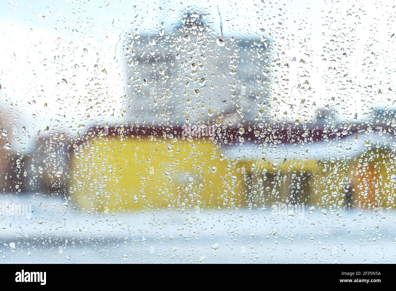 freezing weather. mixed rain and snow. street view from a car window