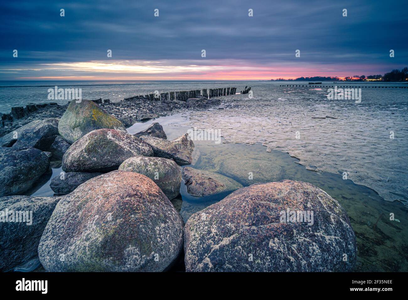 A mesmerizing view of a beautiful rocky seashore at scenic sunset Stock ...