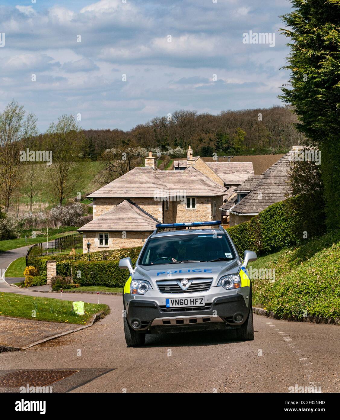 Northamptonshire, England, UK.   4x4 police car driving through a rural village Stock Photo