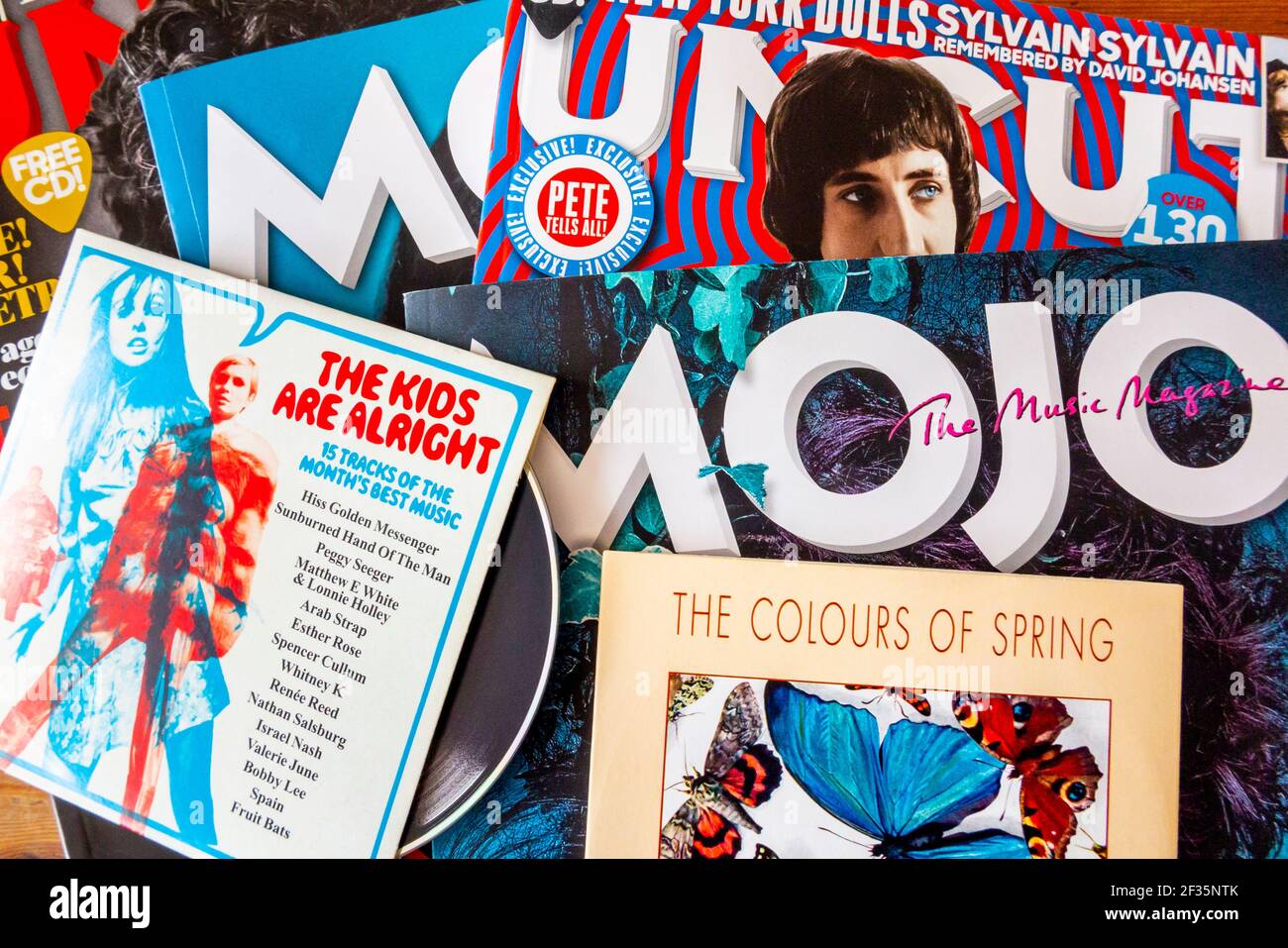 Issues of Uncut and Mojo British music magazines that cover heritage rock  with a free cover mounted CD that is given away with each copy. Stock Photo