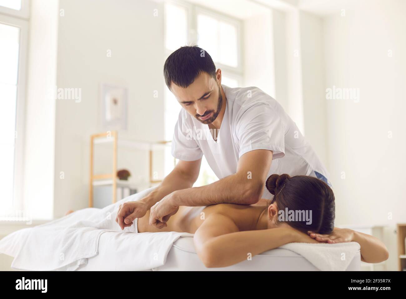 Massage bodycare in medical clinic from professional doctor masseur Stock Photo