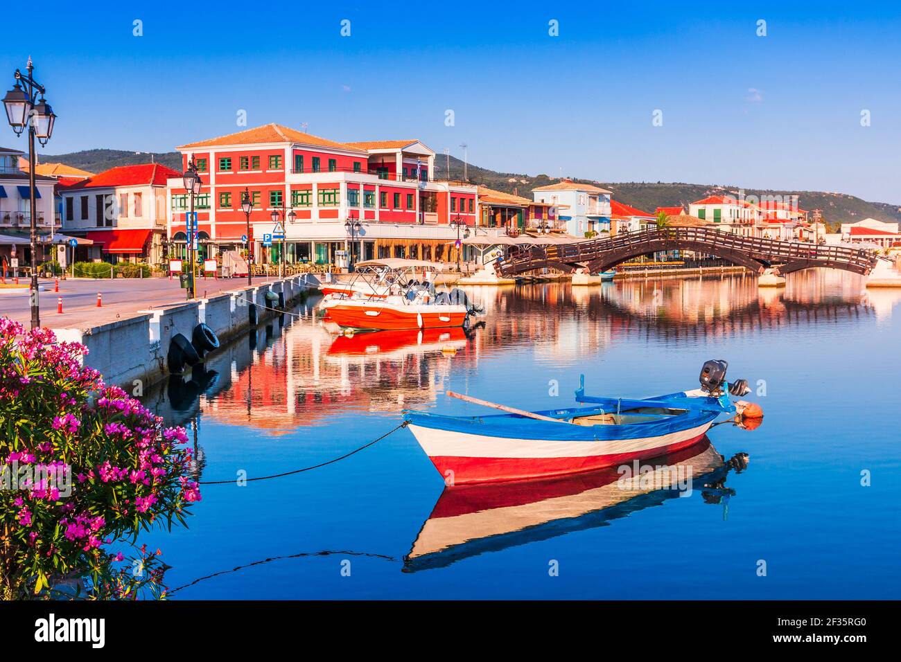 Lefkada, Greece. Small marina for the fishing boats and wooden bridge. Stock Photo