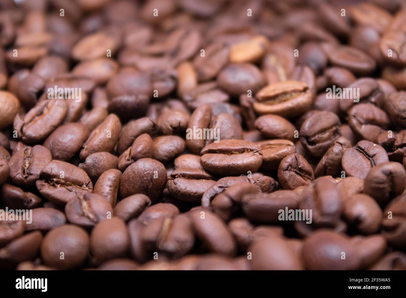 close up Freshly roasted coffee beans background. top view. Stock Photo
