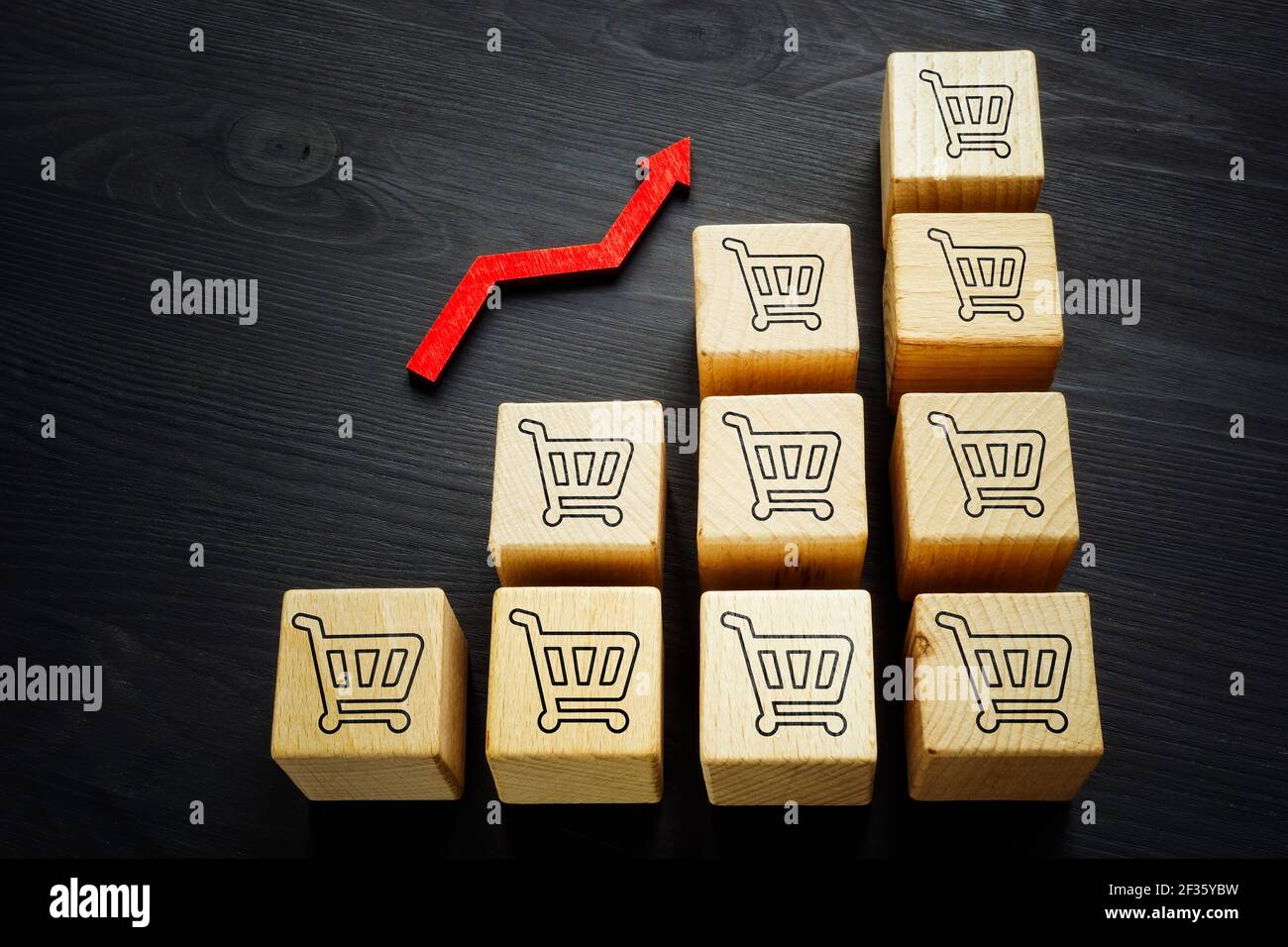 Increase sales and business success. Shopping bags and rising arrow. Stock Photo