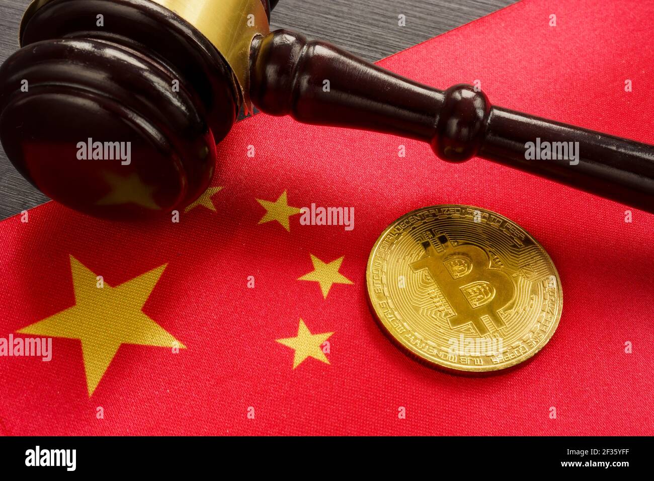 Cryptocurrency law regulation in China. Coin and gavel. Stock Photo