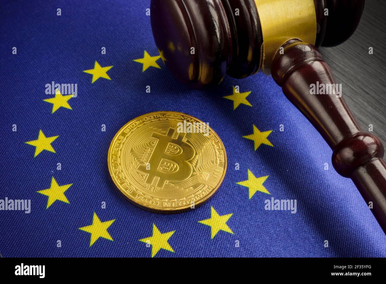 Cryptocurrency legal regulation in EU. Btc on the flag and gavel. Stock Photo