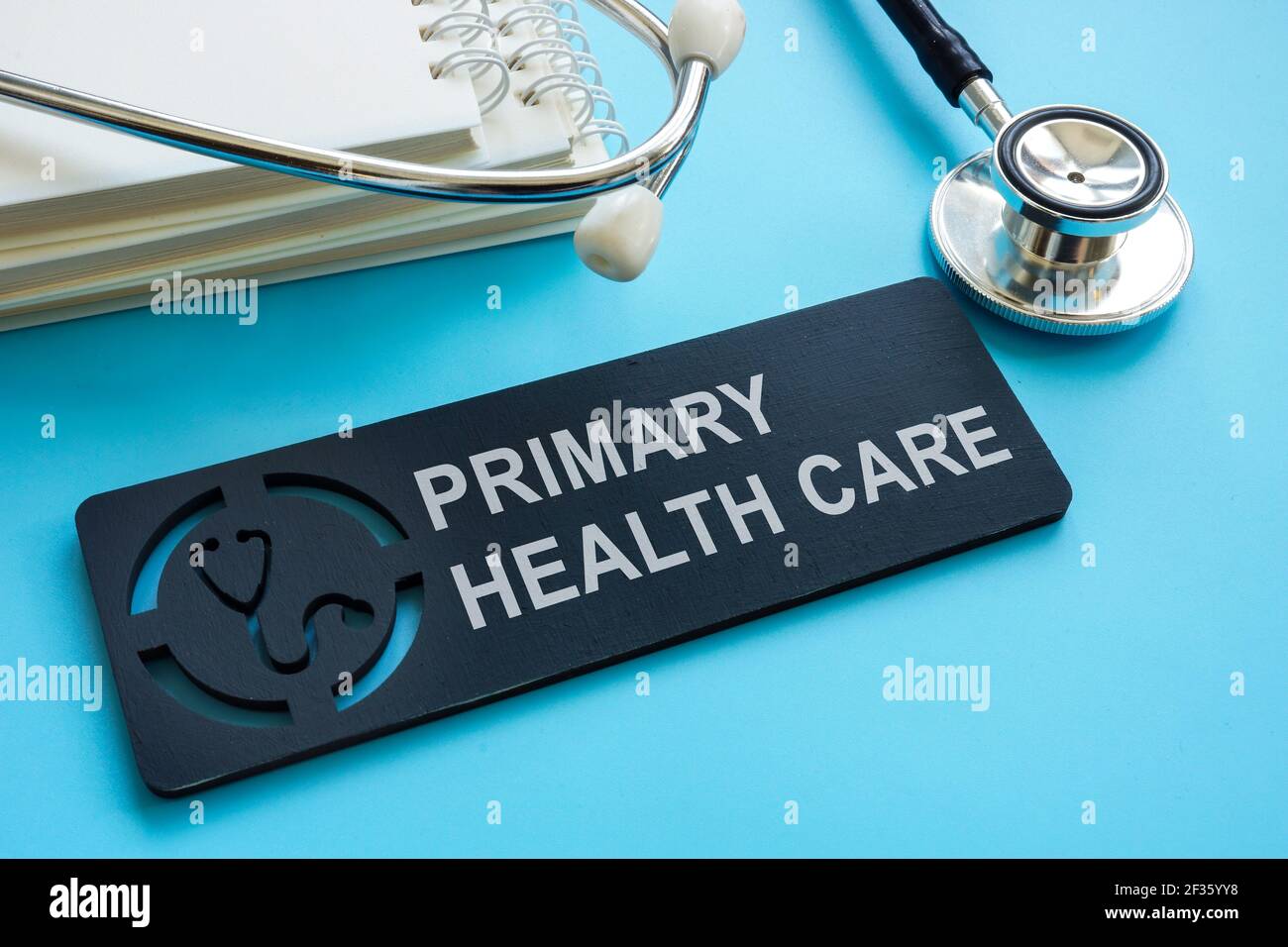 Primary health care sign with papers and stethoscope. Stock Photo