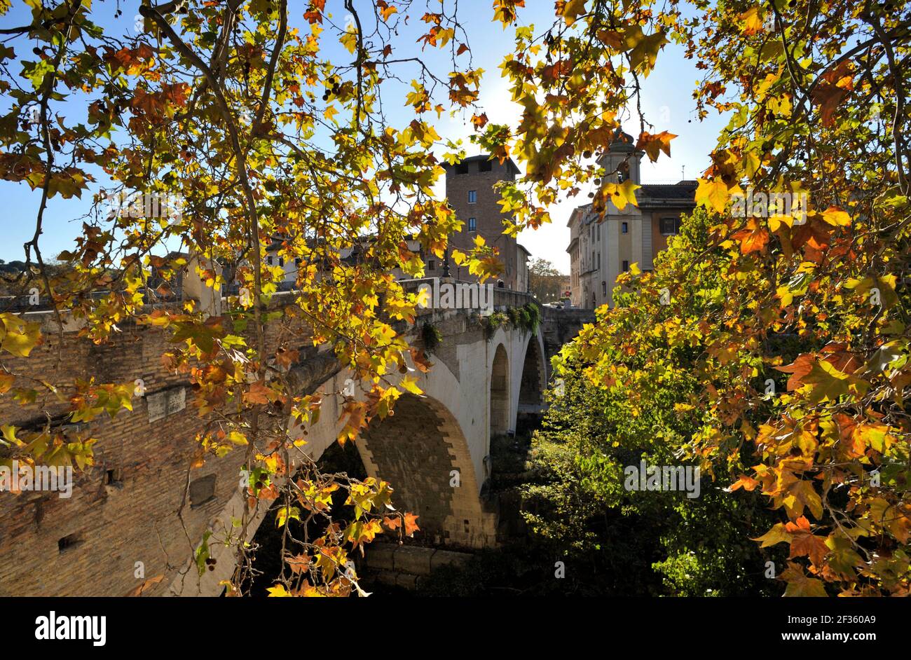 italy, rome, tiber river, pons fabricius bridge in autumn Stock Photo