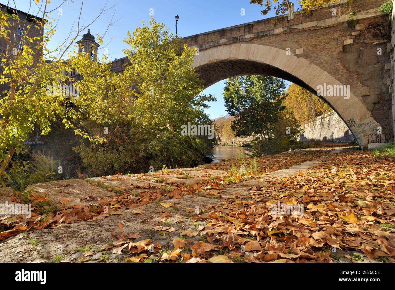 italy, rome, tiber river, riverbank and pons fabricius bridge in autumn Stock Photo