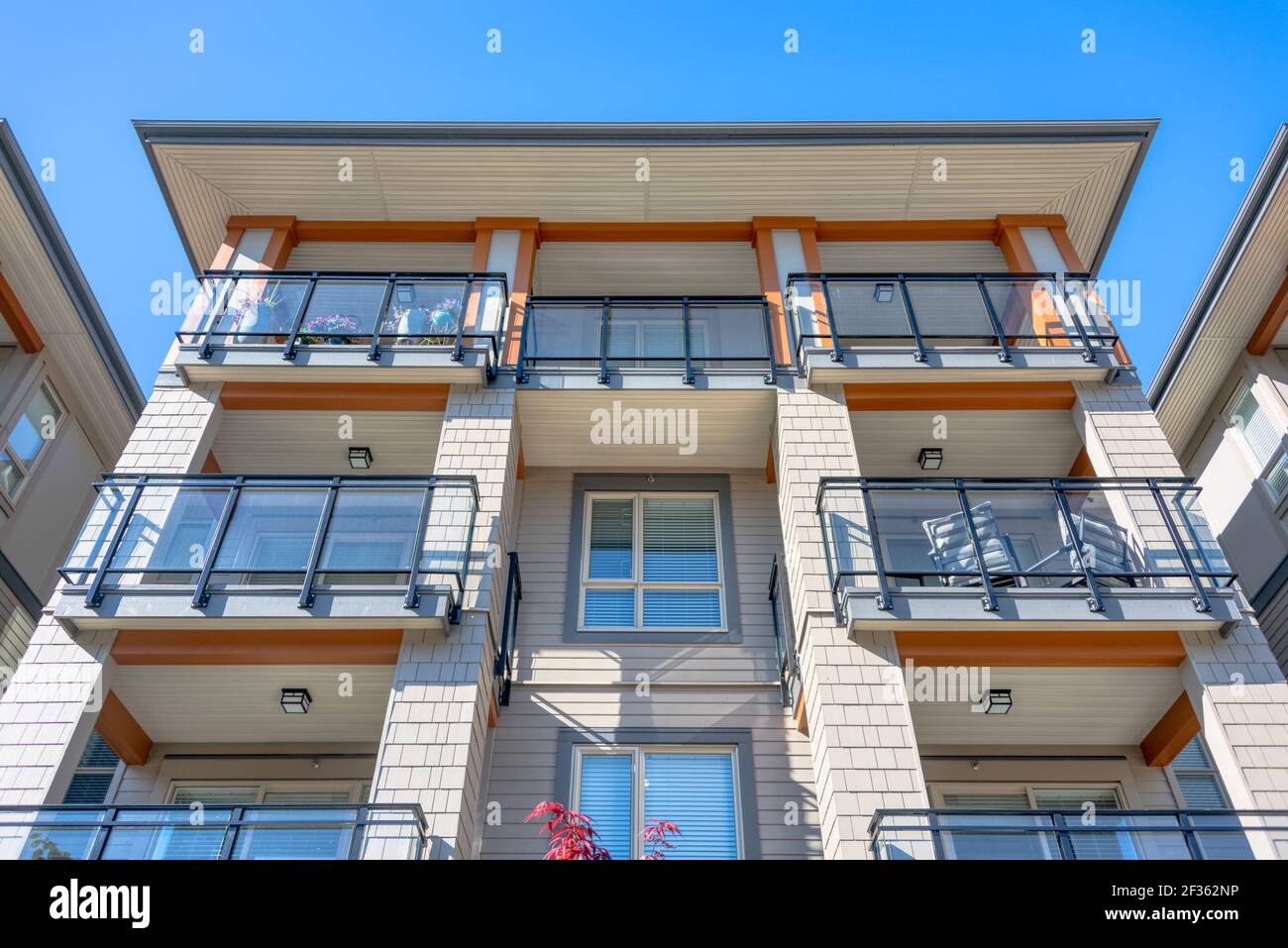 Top levels of new residential building on blue sky background Stock ...