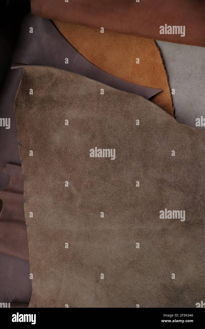 Leather brown pieces and rolls.Leatherworking. Genuine leather piece