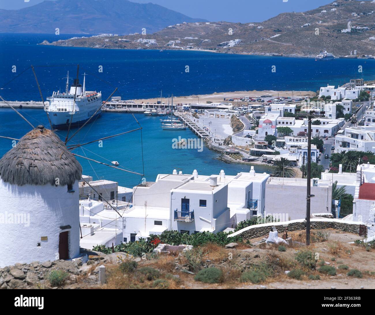 Greece, Cyclades Islands, Mykonos, Port with cruise boat. Stock Photo