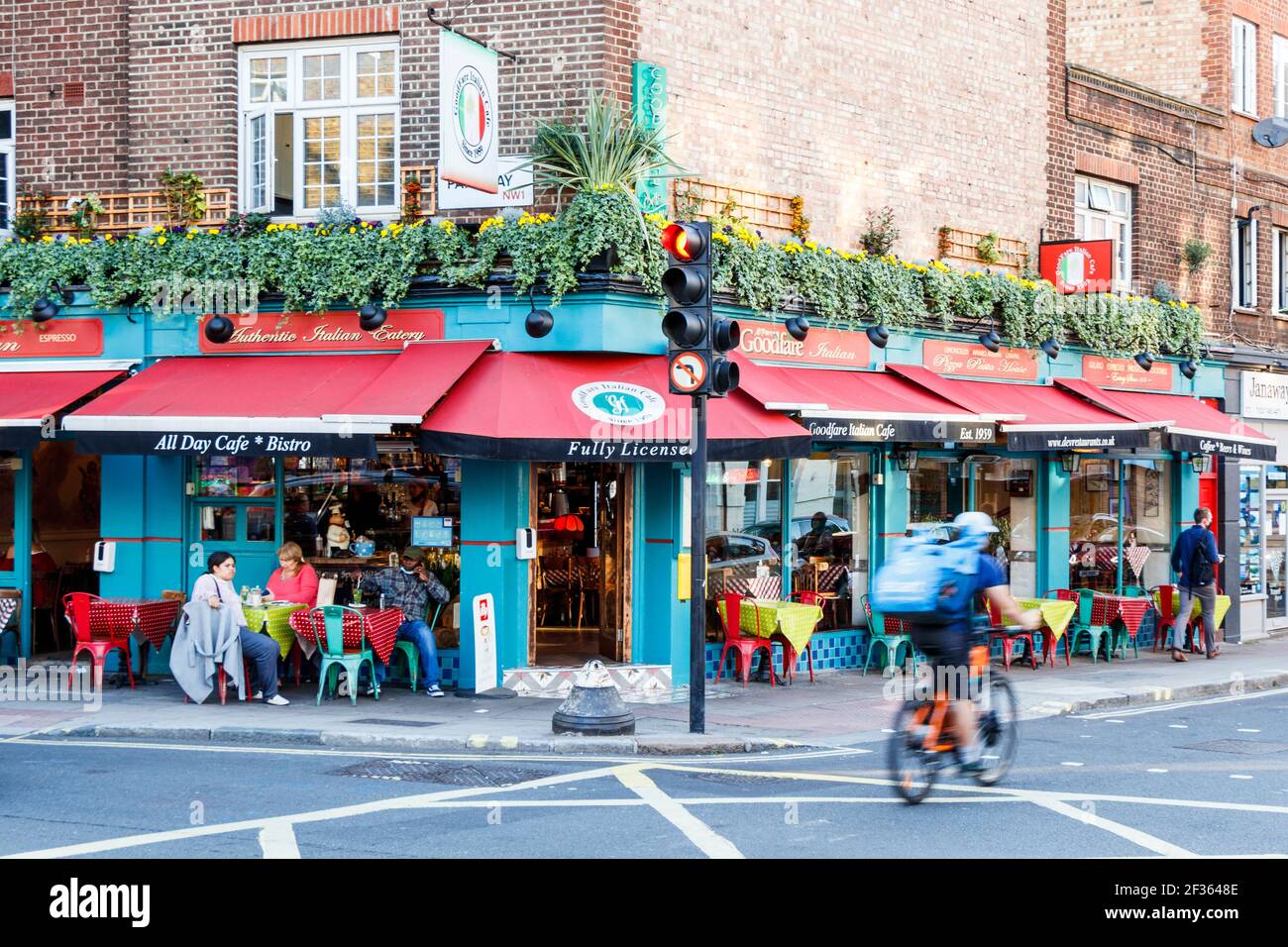 Diners eating outside The Goodfare Italian Restaurant, a long-established restaurant in Parkway, Camden Town, London, UK during lockdown Stock Photo