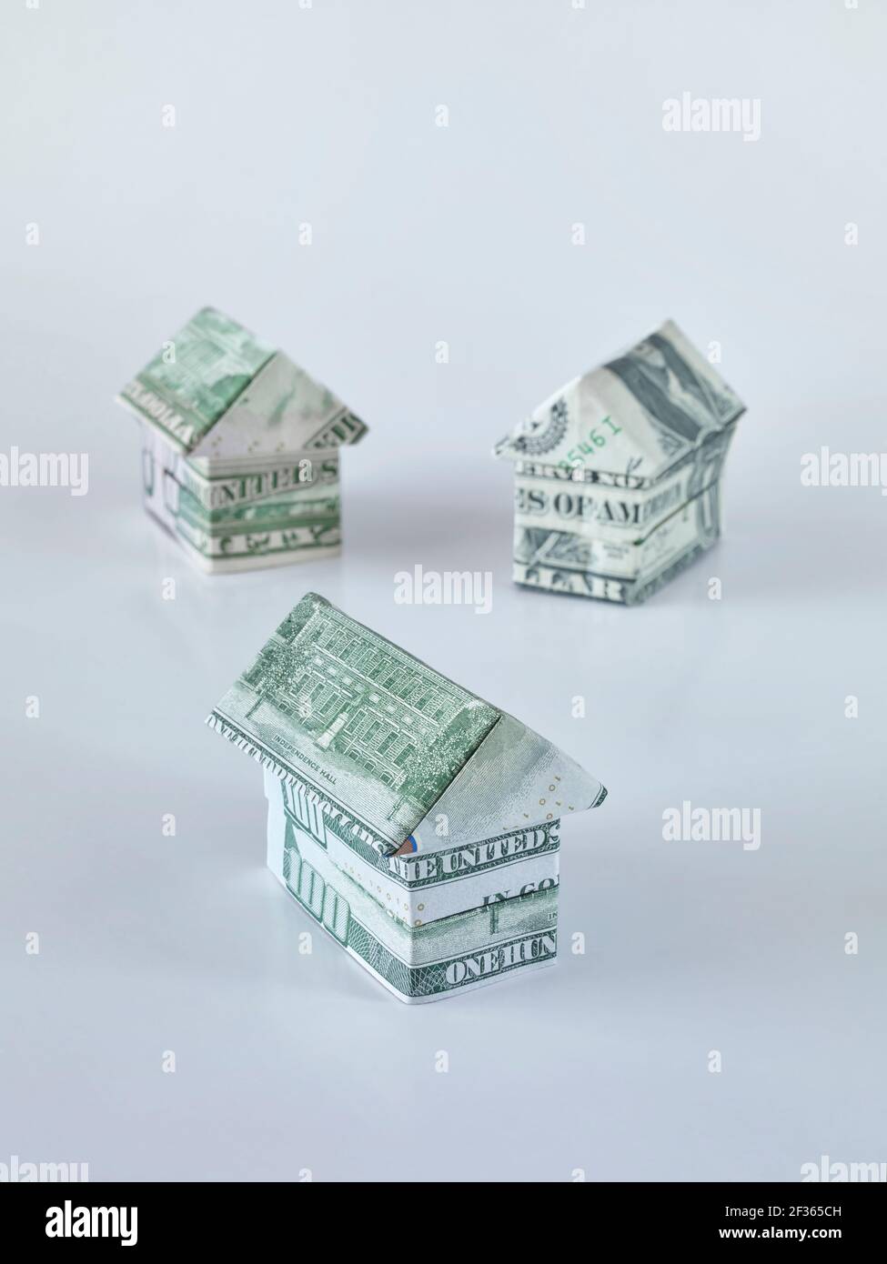 Origami houses made of dollar bills Stock Photo