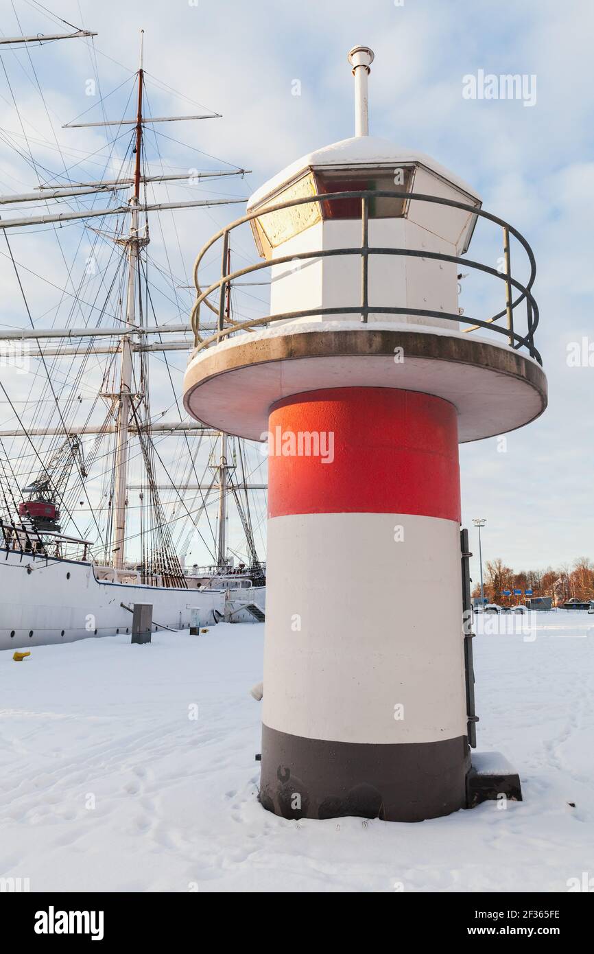 Red white lighthouse tower on a cold sunny winter day. Port of Turku, Finland Stock Photo