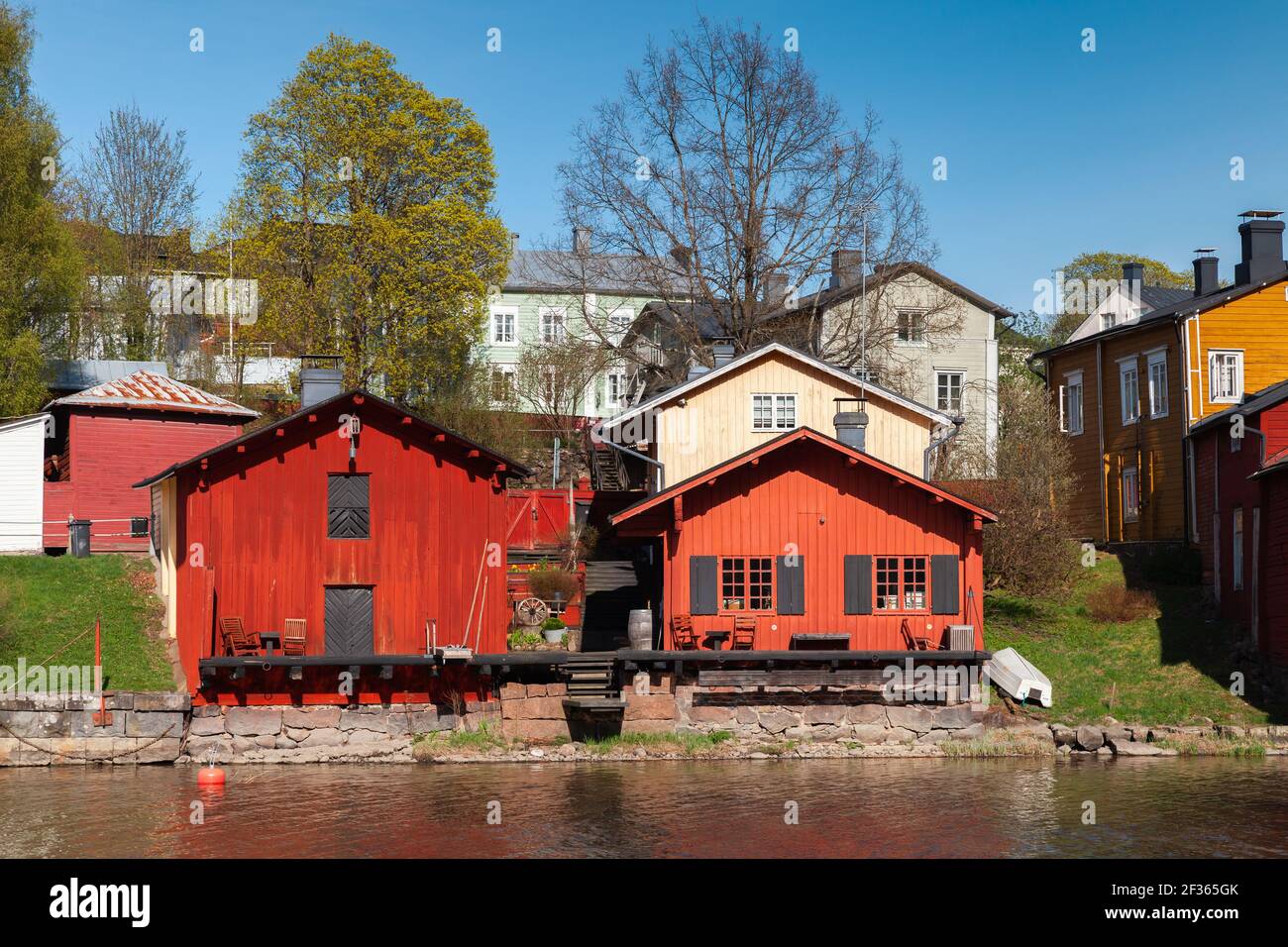 Porvoo town view on a sunny spring day, Finland. Old red wooden houses on the river coast Stock Photo