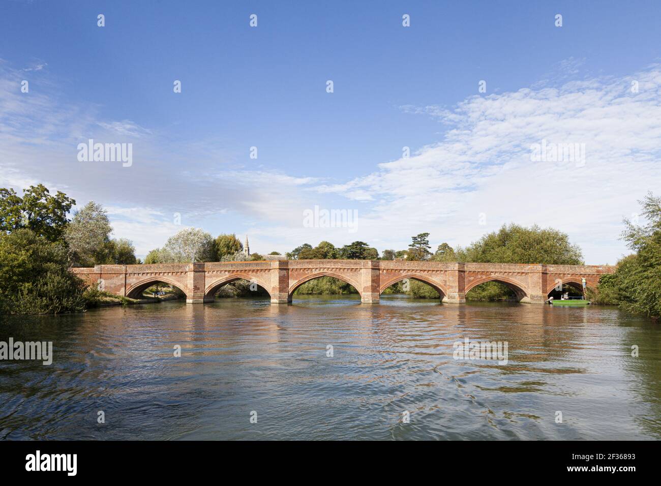 The brick bridge built by Sir Gilbert Scott in 1864 over the River Thames at Clifton Hampden, Oxfordshire, UK Stock Photo