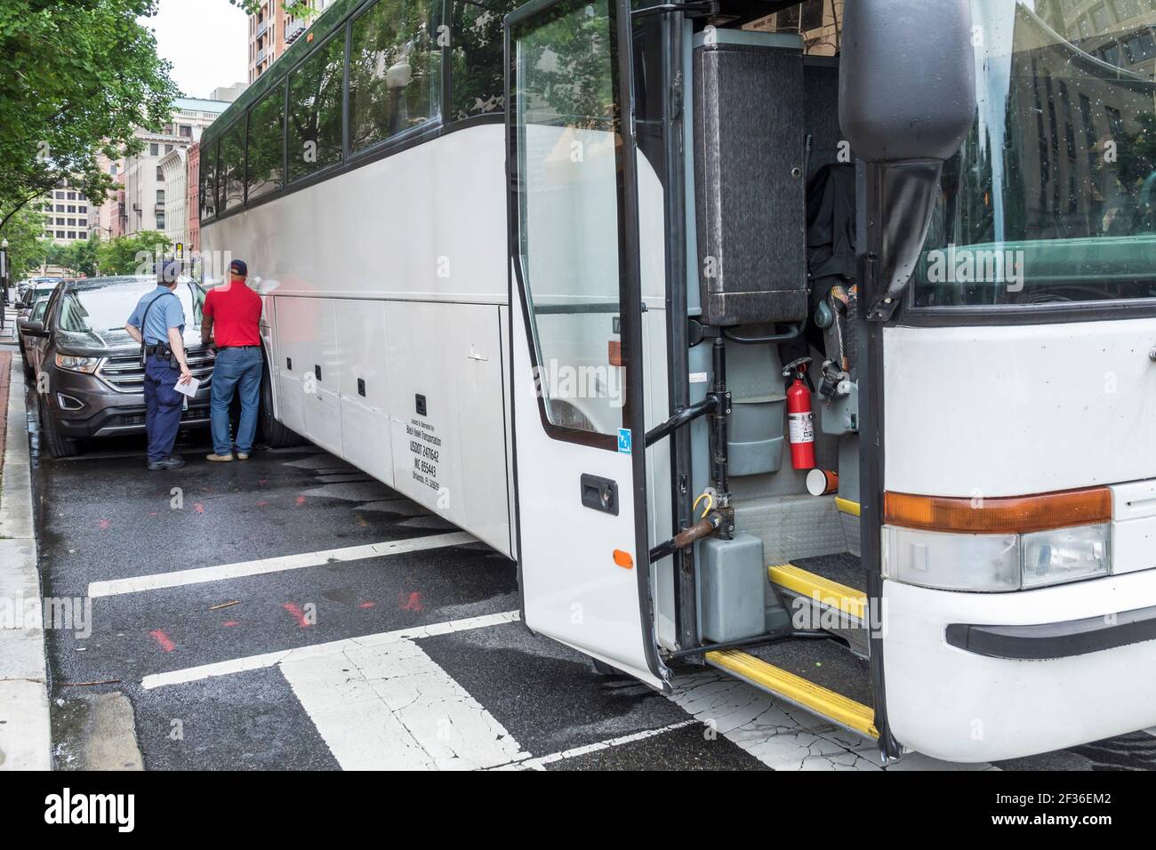 Washington DC,District of Columbia,collision car bus sideswipe accident tight space misjudge,driver policeman, Stock Photo