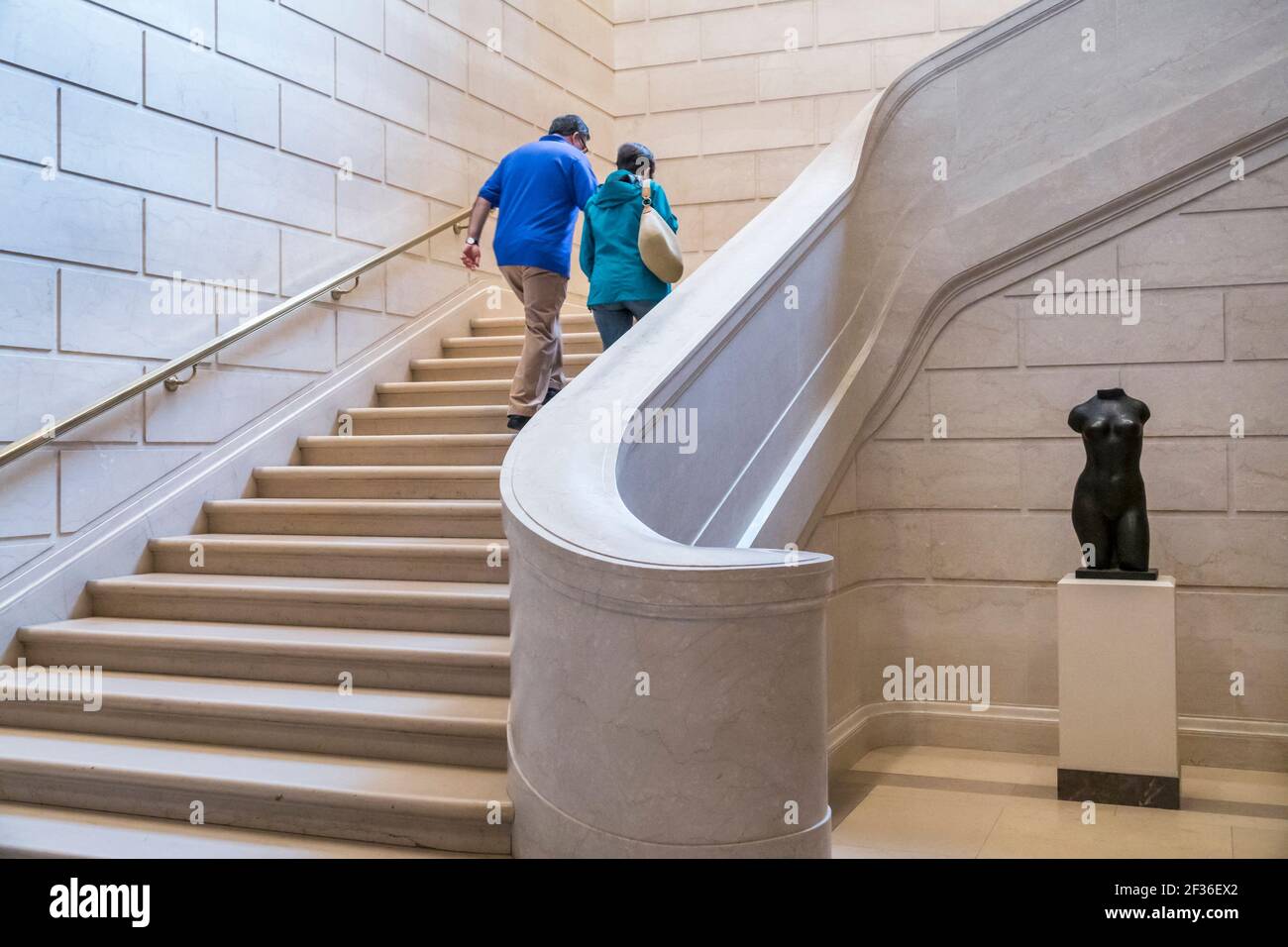 Washington DC,National Gallery of Art Museum,inside interior stairs man woman female couple ascending going up, Stock Photo