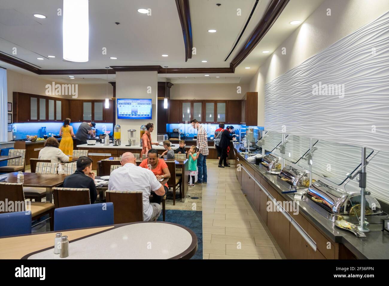 Washington DC,Homewood Suites by Hilton,hotel dining room free included breakfast buffet inside interior,guests eating, Stock Photo