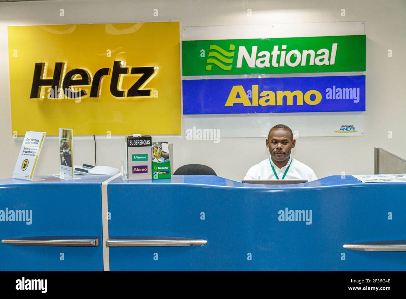 Santo Domingo Dominican Republic,Las Américas International Airport SDQ,Hispanic Black man Hertz National Alamo rent car rental counter,agent employee Stock Photo
