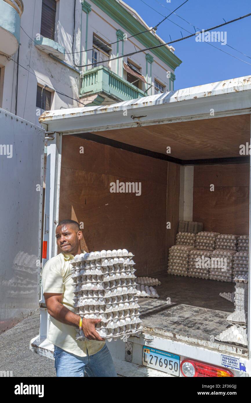 Santo Domingo Dominican Republic,Ciudad Colonia Zona Colonial,Calle Santome Hispanic man delivery truck eggs wholesale distributor,carrying, Stock Photo