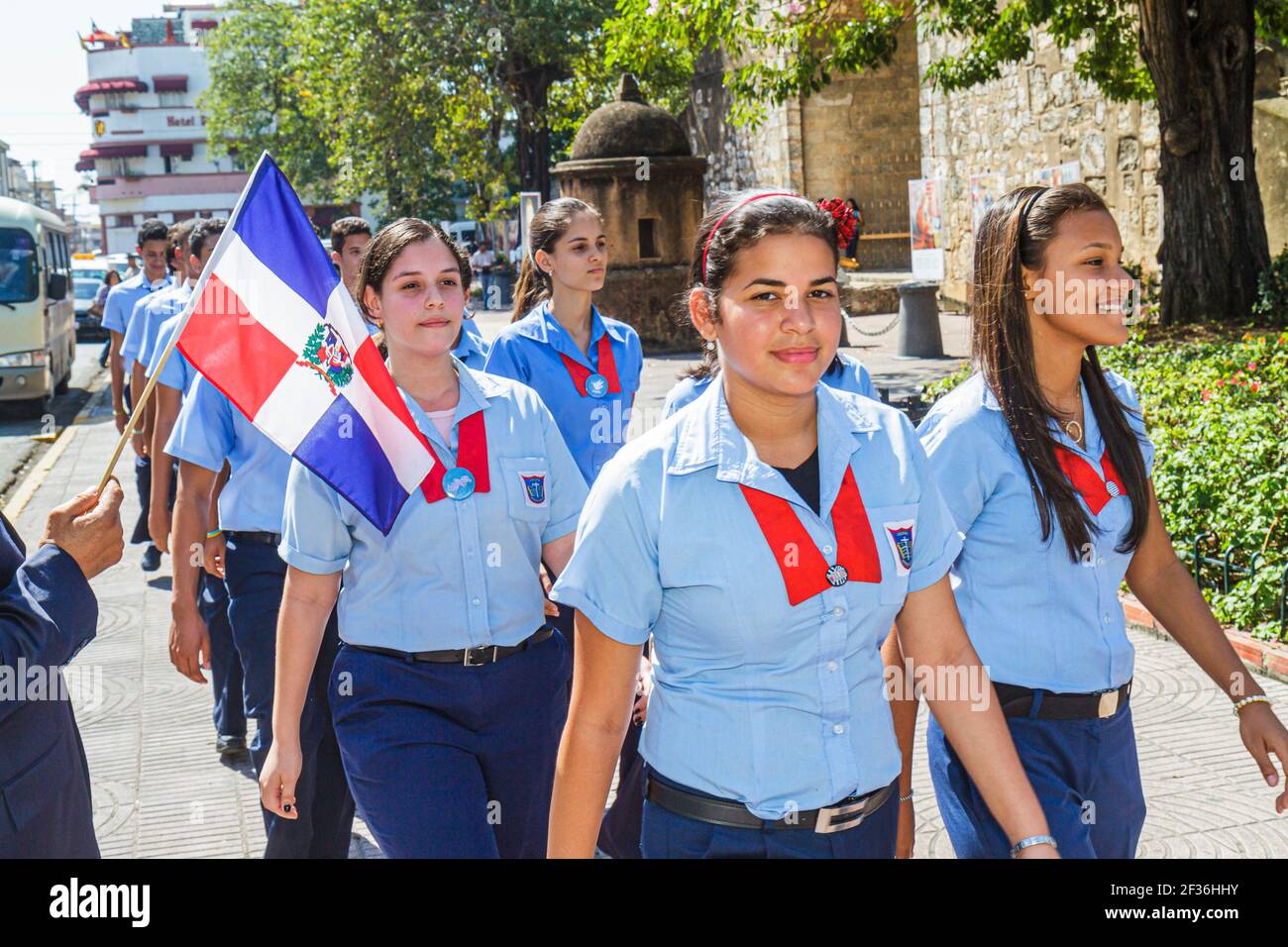 Santo Domingo Dominican Republic,Ciudad Colonial Puerta Del Conde,Calle Hincado school uniforms Hispanic Black students teen teenage girls,flag class Stock Photo