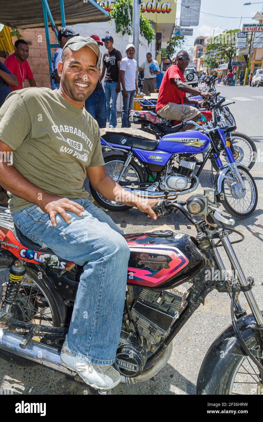 Santo Domingo Dominican Republic,Bajos de Haina motorcycle taxi motoconcho,public transportation self employed Hispanic Black man, Stock Photo