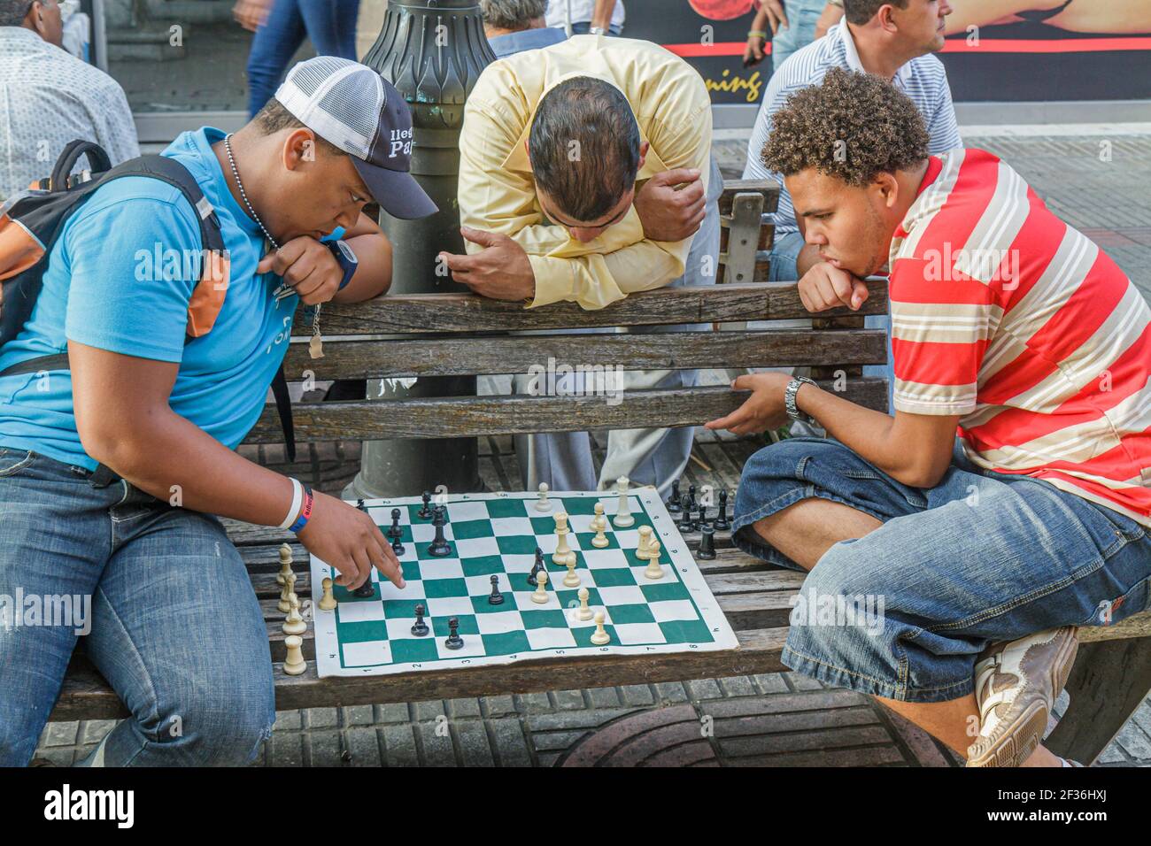 Teenager Playing Chess with his Grandfather · Free Stock Photo