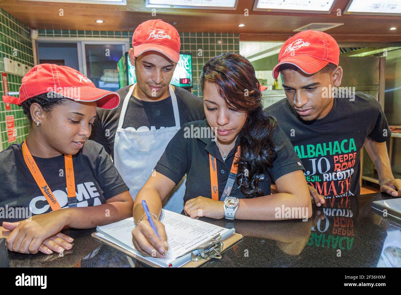 Santo Domingo Dominican Republic,Ciudad Colonial Calle el Conde Peatonal,Pizzarelli pizzeria restaurant Black Hispanic men women employees workers job Stock Photo