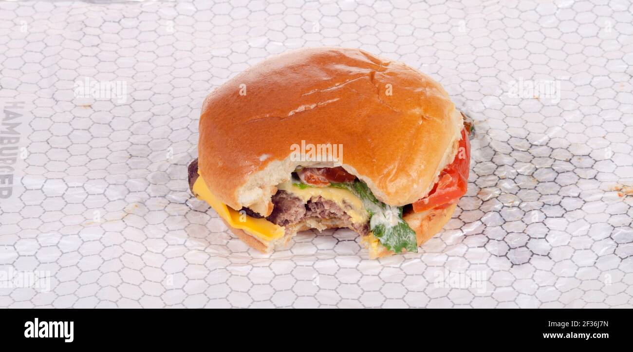 Wendy's Dave's Single Classic Cheeseburger with Bite Taken on Wrapper Stock Photo
