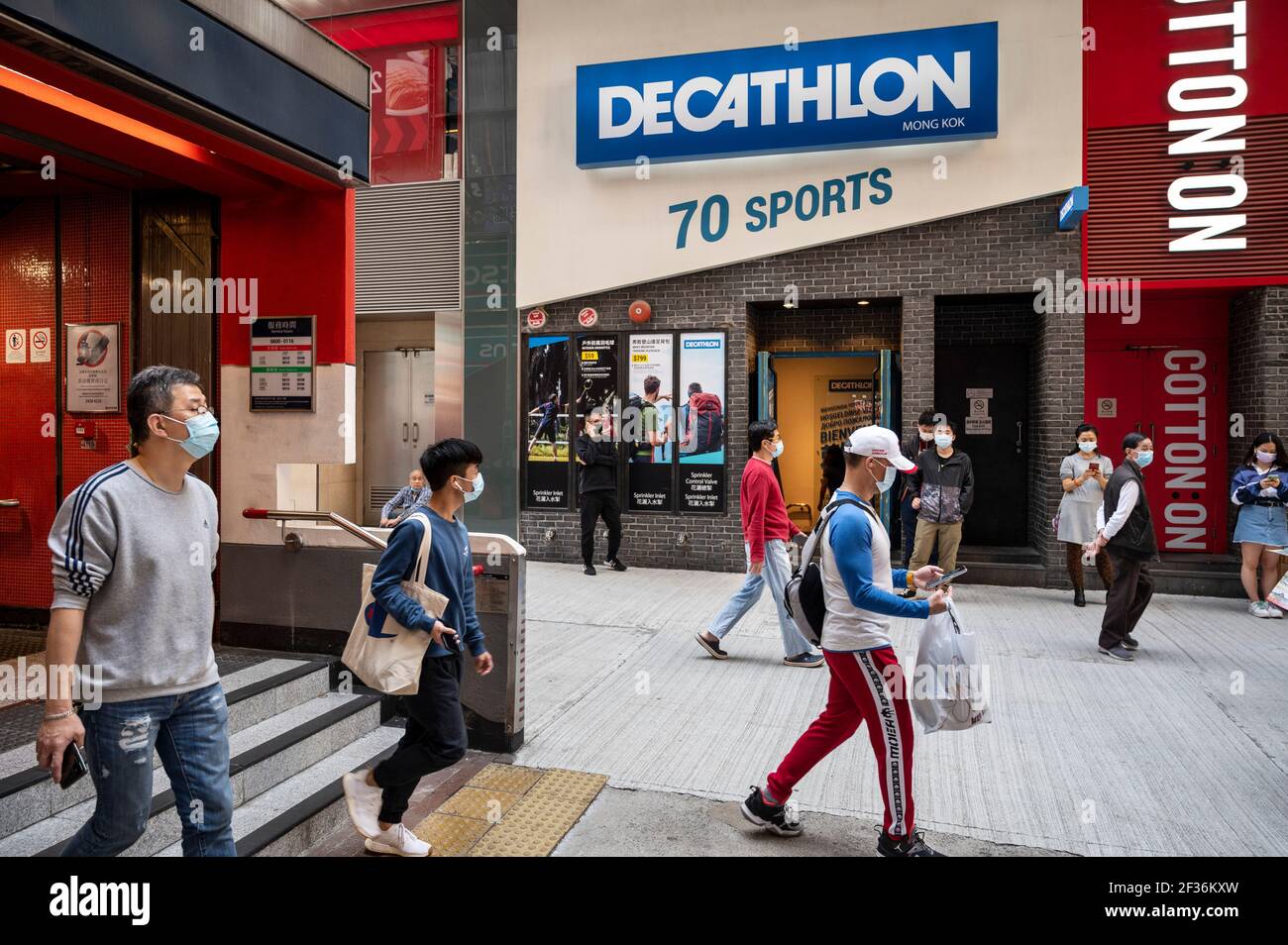 Pedestrians walk past the French sporting goods Decathlon and Australia's  largest clothing retailer Cotton On stores in Hong Kong. (Photo by Budrul  Chukrut / SOPA Images/Sipa USA Stock Photo - Alamy
