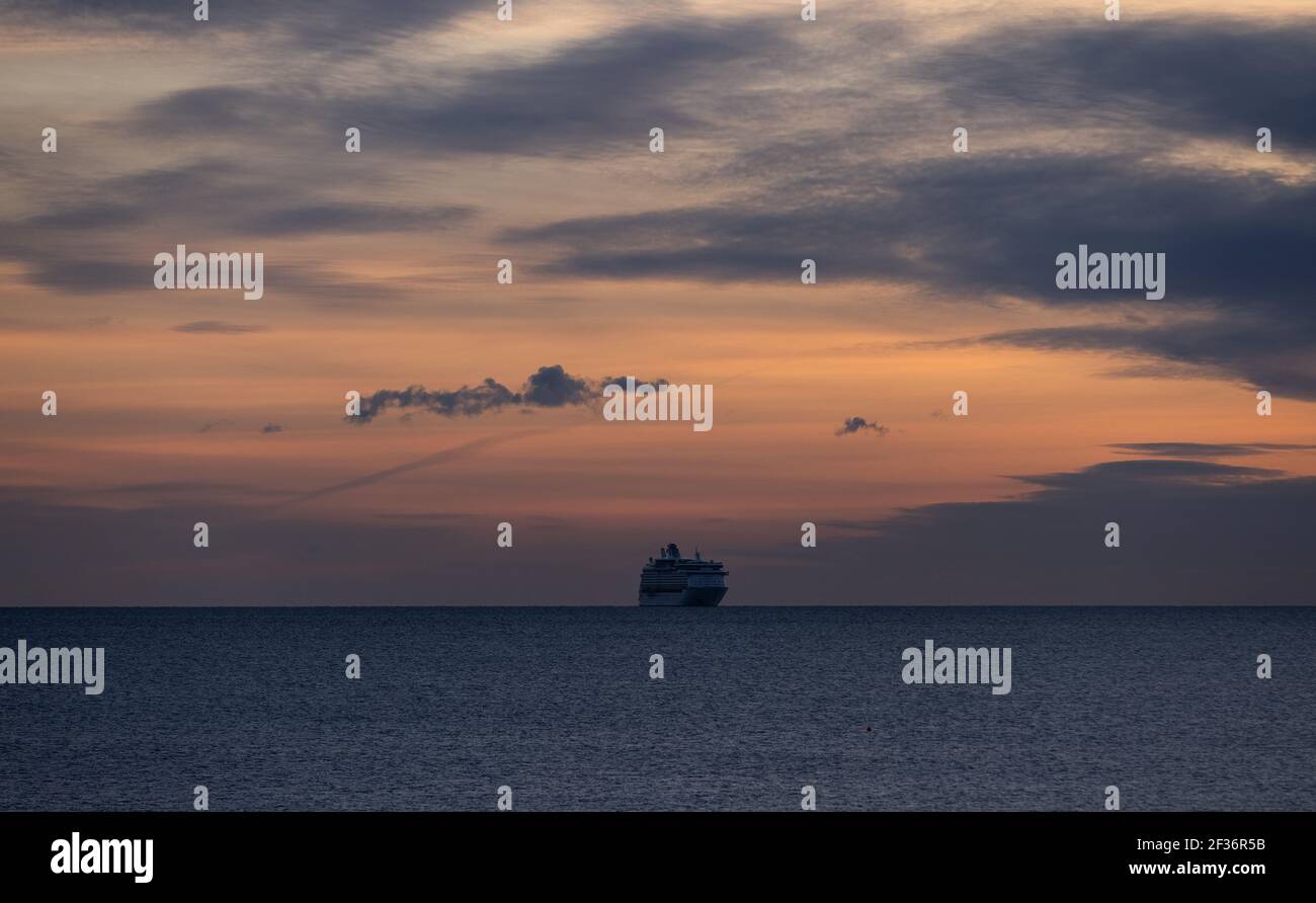 Cruise ship anchored at sea seen from Hengistbury Head in Southbourne