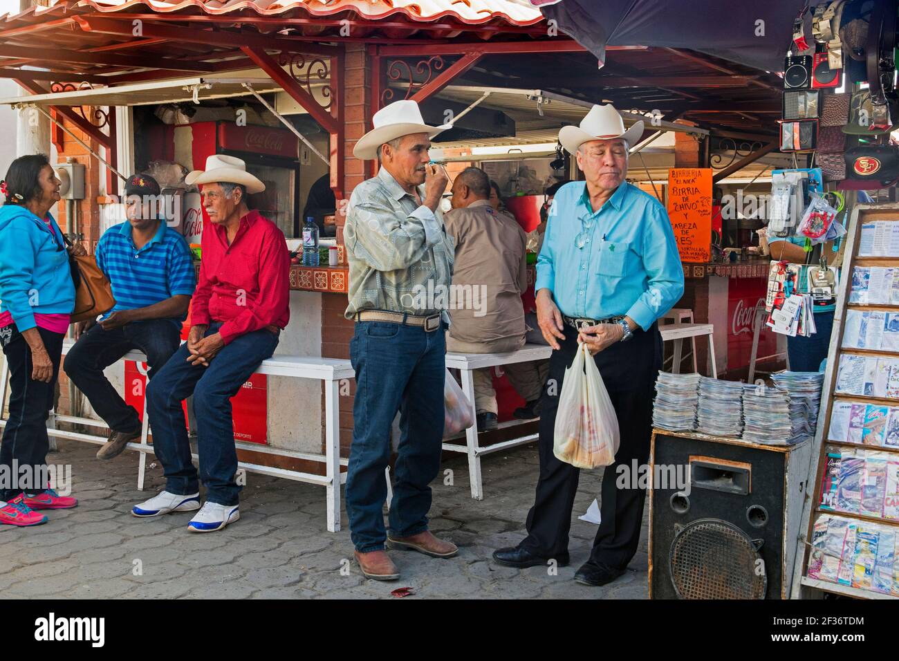 Local elderly Mexican men wearing cowboy hats at market in the city El Fuerte, Sinaloa, Mexico Stock Photo