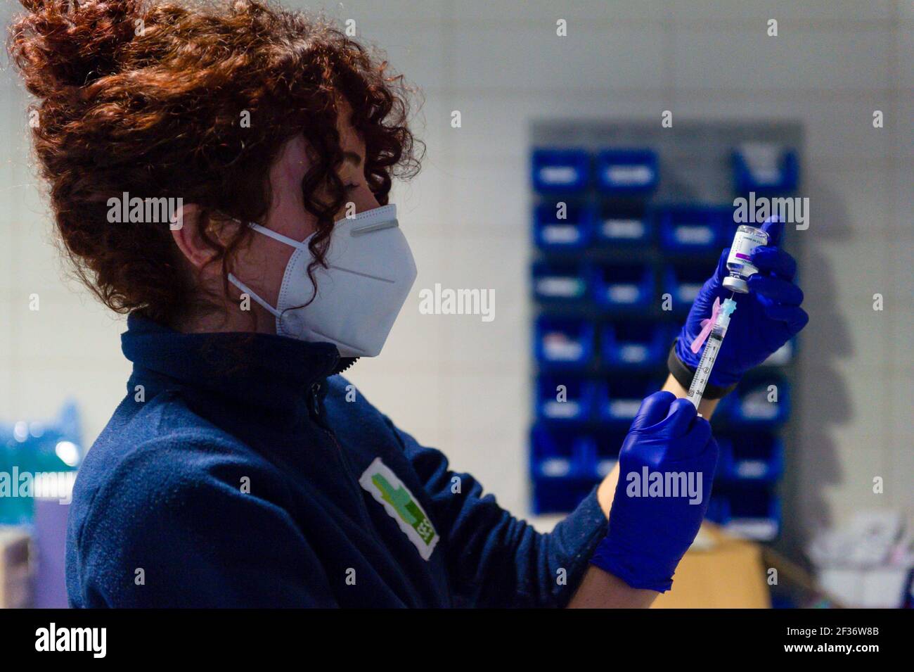 A healthcare worker prepares a syringe with the Astra Zeneca Covid19 dose at Coria City Hospital. Some European countries have cancelled the administration of AstraZeneca vaccine due the appearance of some side effects in people who had received it recently. Stock Photo