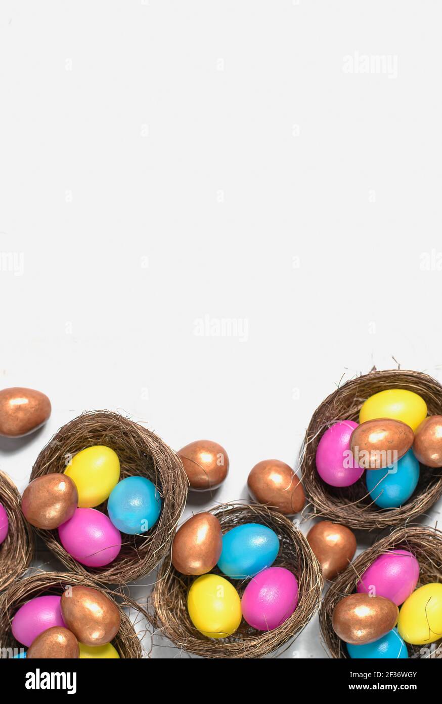 Colorful Easter eggs in nests. Stock Photo