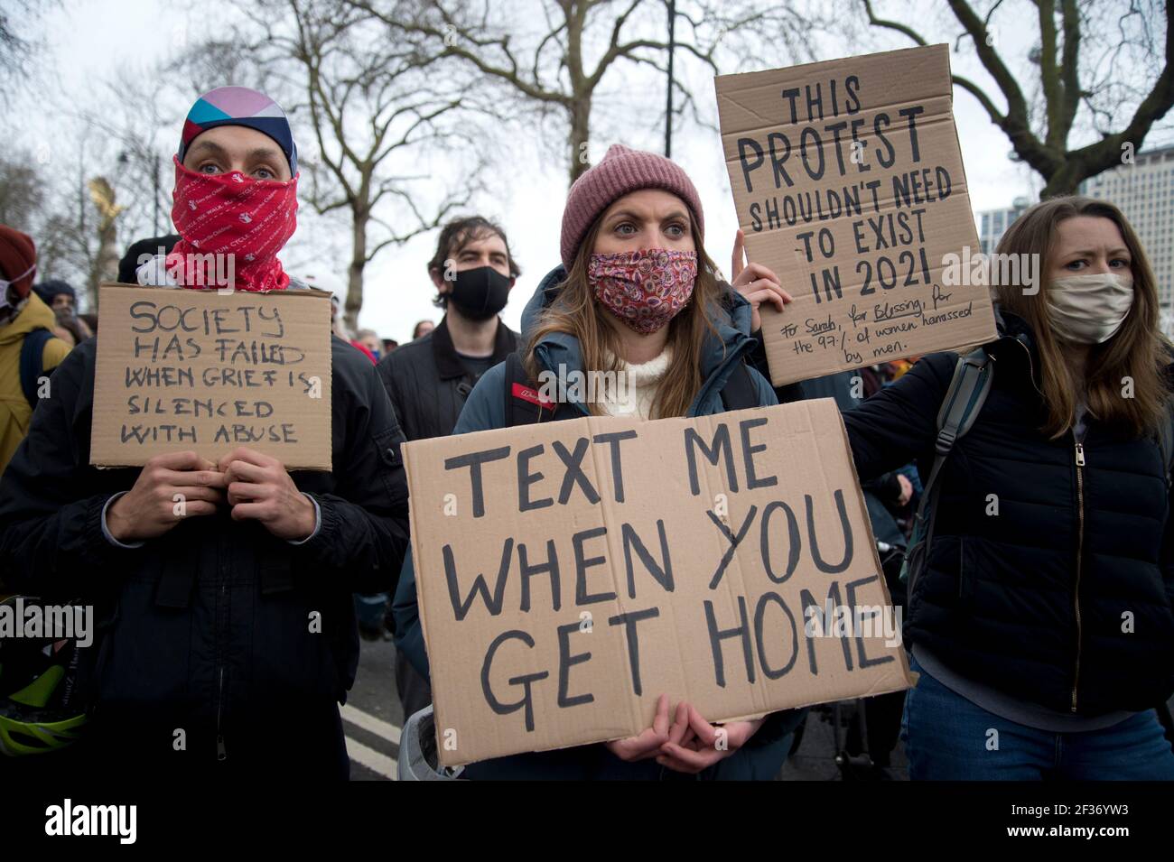 New Scotland Yard. 14/03/2021. Protest over the heavy handed policing of the vigil on Clapham Common for Sarah Everard the night before. Women hold ha Stock Photo