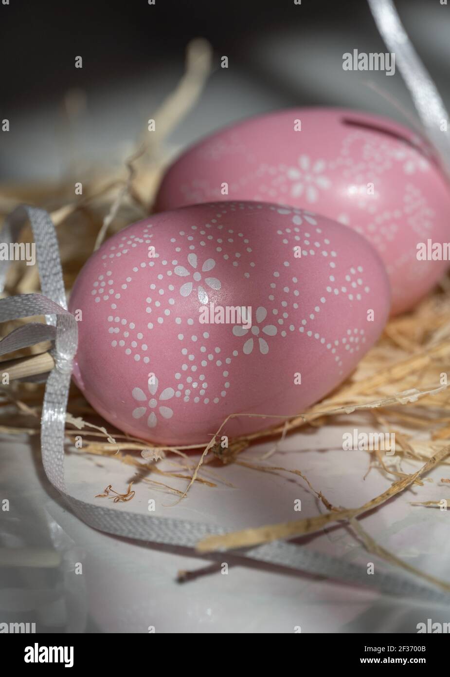 Two Easter pink eggs, beautiful background with shadows Stock Photo
