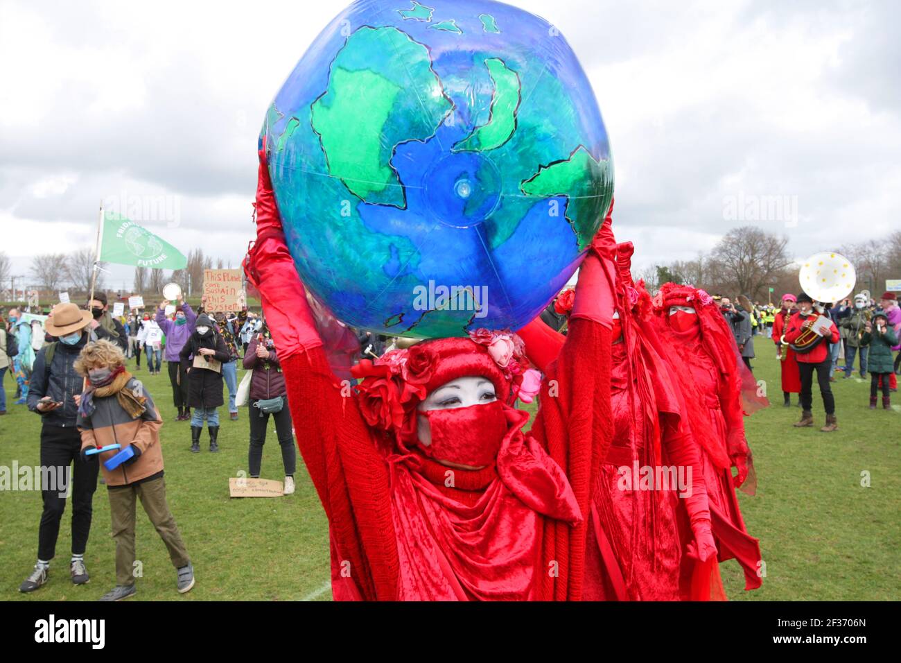 Environmental activists Red Rebell Extinction Rebellion  hold a globe  protest during nationwide clima alarm at the Wester Park amid the coronavirus p Stock Photo